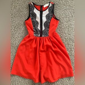LuLu’s size small adorable dress. Color is red/orange with black lace.